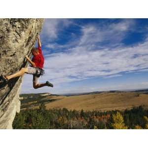 Young Man Climbing the Rock Feature Known as Bobcat Logic Stretched 