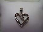 Nice 10K White Gold Diamond Heart, round and baguettes