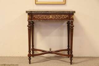 vintage game table has a flip and swivel top with inlaid marquetry 