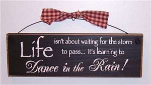 LIFE ISNT ABOUT WAITING FOR THE STORM TO PASS Sign  