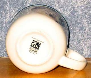 National Wildlife Federation white wolf 3 1/4 coffee mug. Mug is free 