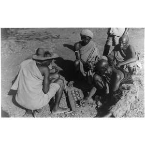  African men playing board game stones, Kenya 1940s